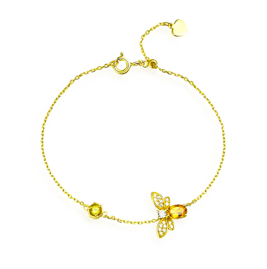 Handcrafted citrine bracelet with polished golden-yellow gemstones on sterling silver chain.