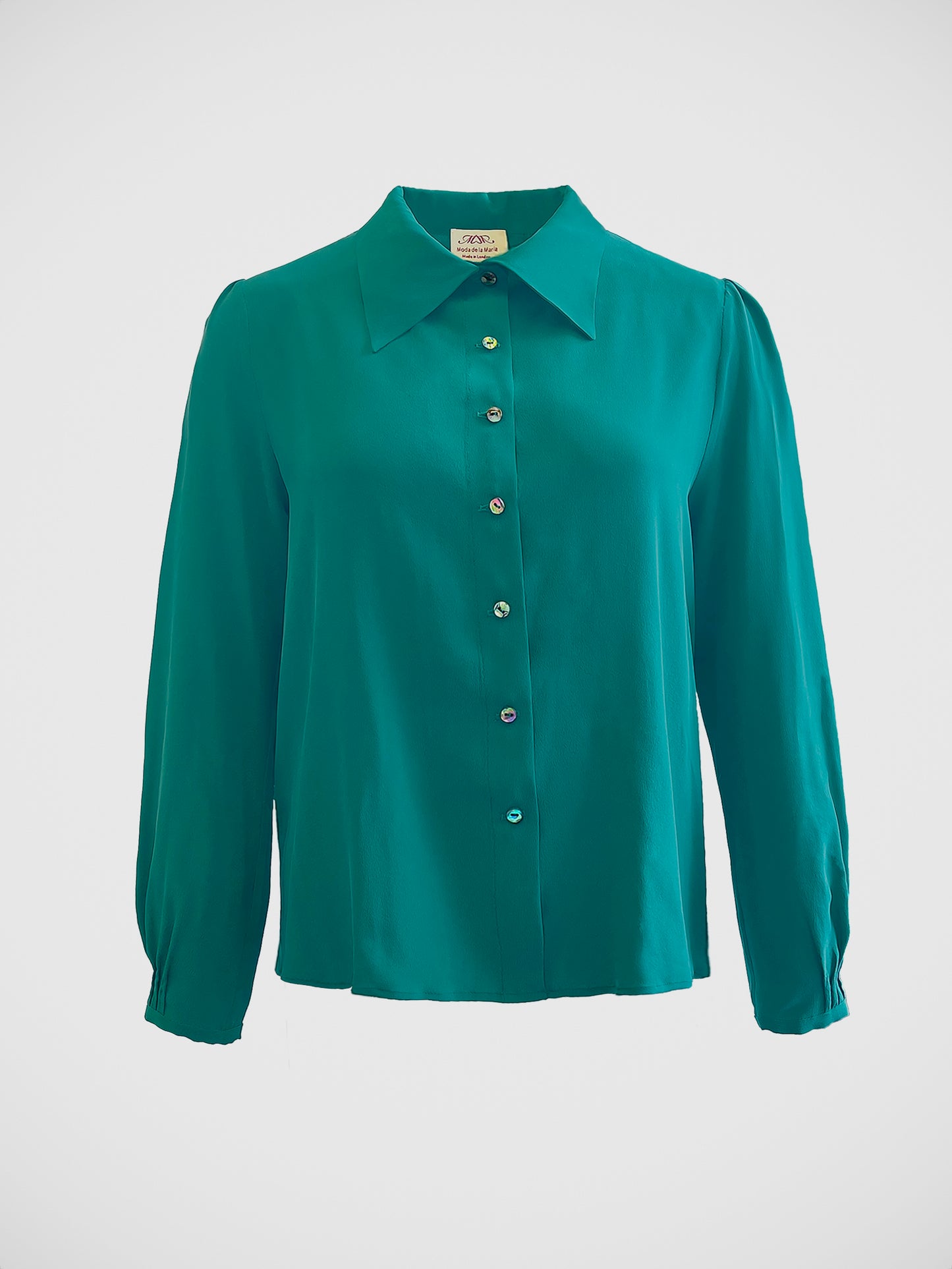 Luxury women’s blouse crafted from 100% Mongolian silk, adorned with natural pearl shell buttons, handmade by Moda de la Maria in London.