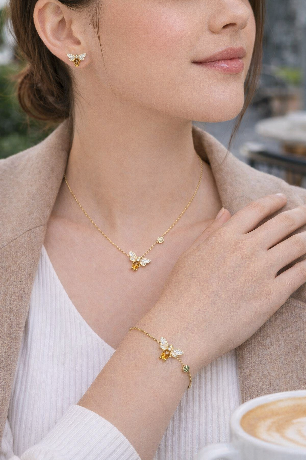 Gold plated sterling silver bee bracelet with citrine gemstone, worn on wrist