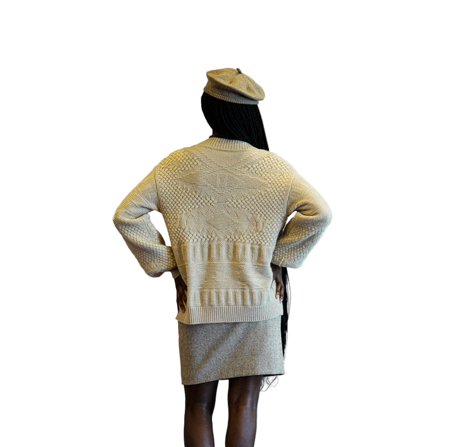 Elegant organic cashmere cardigan in soft white, highlighting fine knit design.