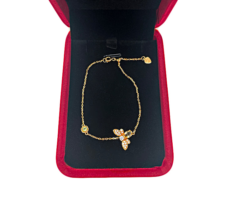 Citrine bracelet layered with silver and gold bangles, creating a refined luxury jewellery look.