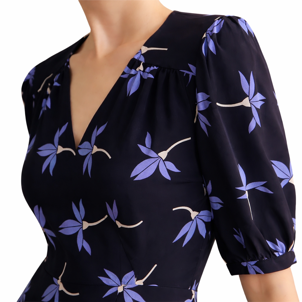 Close-up of Mulberry silk Crepe de Chine fabric with intricate floral digital print and natural sheen.