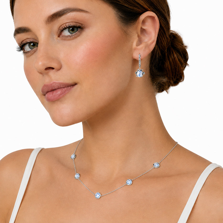 Close-up of model wearing a five stone moonstone necklace in sterling silver