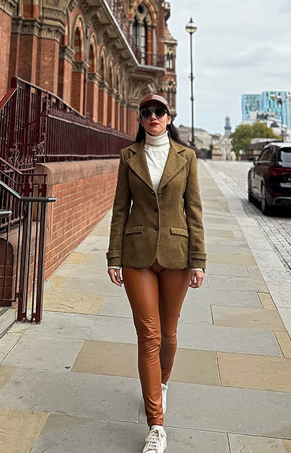 Alessandra G. wearing a bespoke tweed jacket by Moda de la Maria, symbolising craftsmanship and elegance.