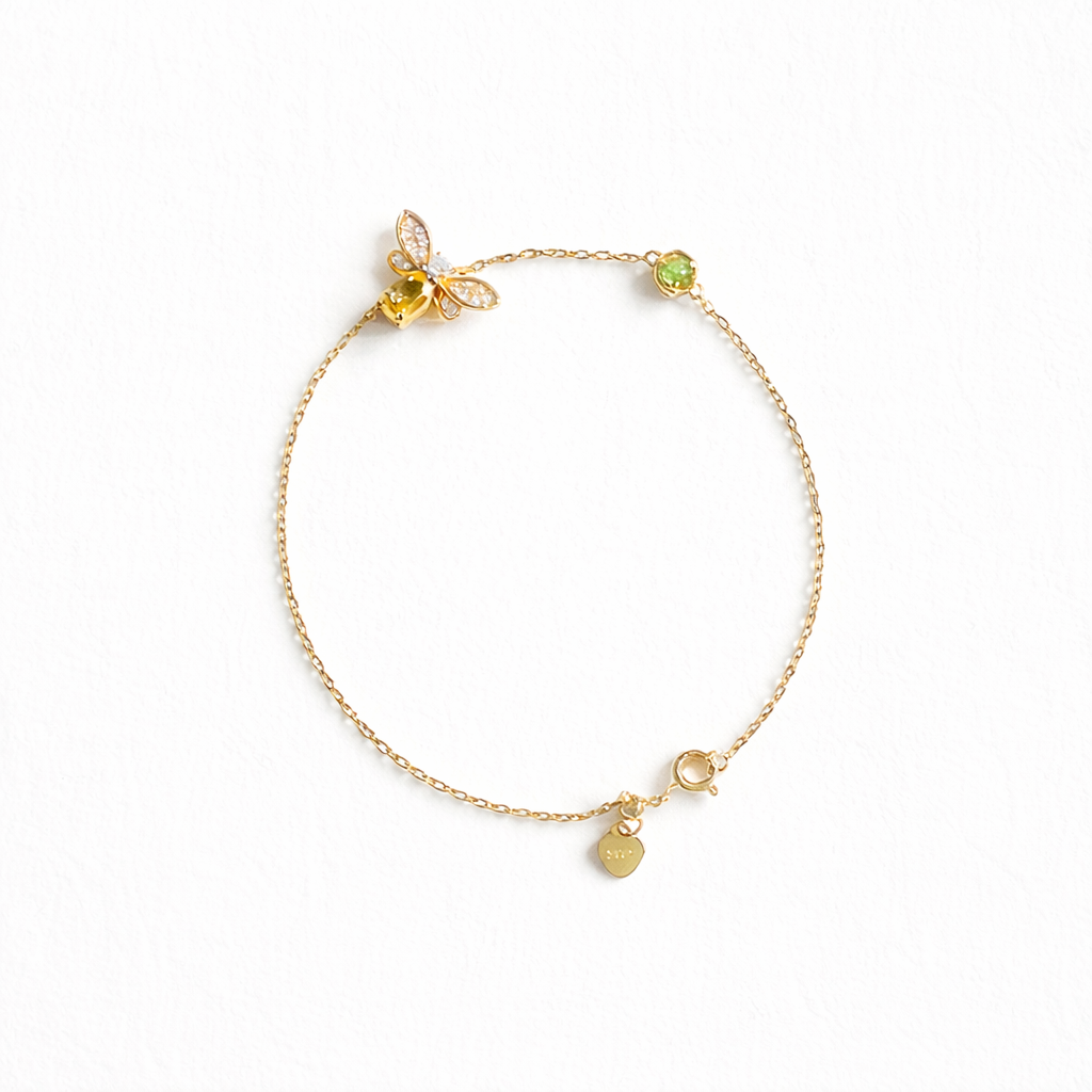 Citrine bee charm bracelet in gold plated sterling silver on white background