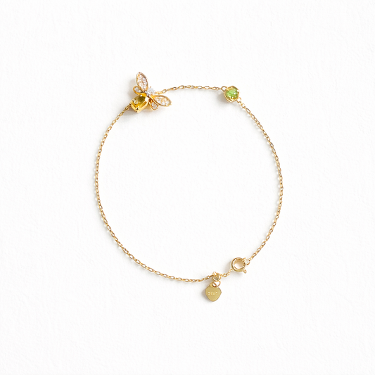 Citrine bee charm bracelet in gold plated sterling silver on white background
