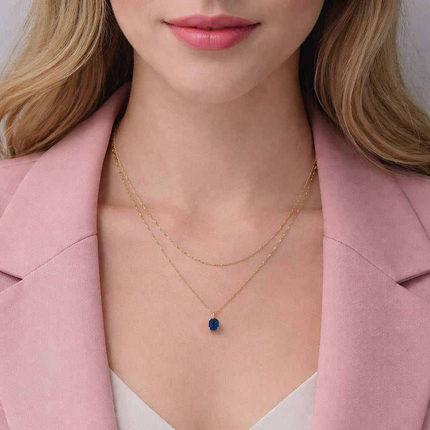 Deep blue sapphire pendant necklace with faceted natural gemstone, luxury artisan jewellery