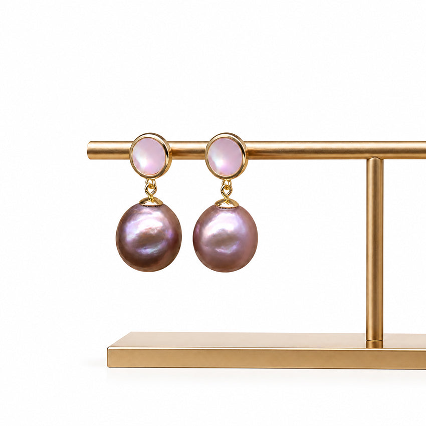 Baroque freshwater pearl drop earrings with gold-plated setting on a pure white background, handcrafted luxury pearl jewellery featuring natural iridescent pearls