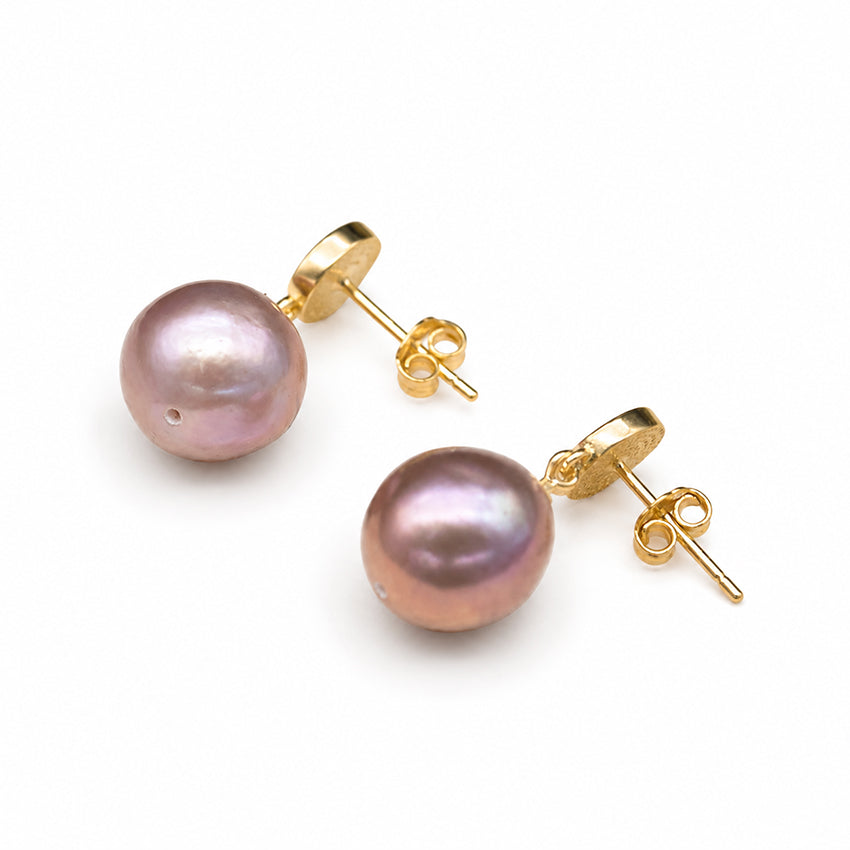 Baroque freshwater pearl stud earrings with gold-plated fittings and butterfly backs on a white background, handcrafted luxury pearl jewellery with natural iridescent pearls.