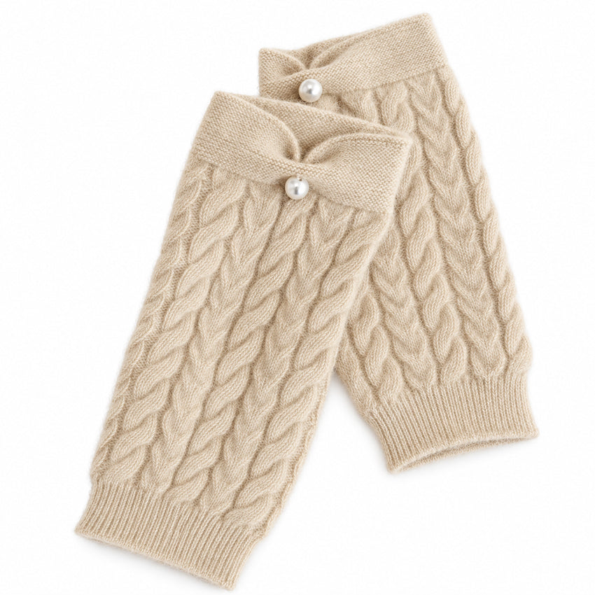 Cream pure cashmere fingerless gloves with cable knit, bow cuff and pearl detail by Moda de la Maria.
