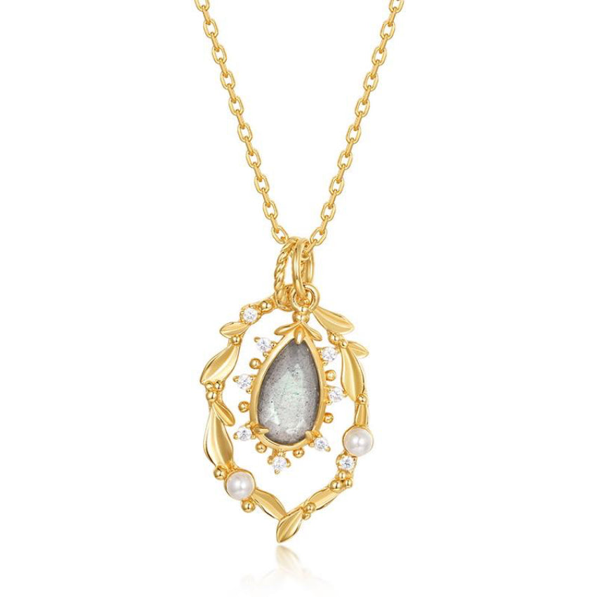 Gold labradorite pendant with pearl wreath and crystal accents necklace on pure white background.
