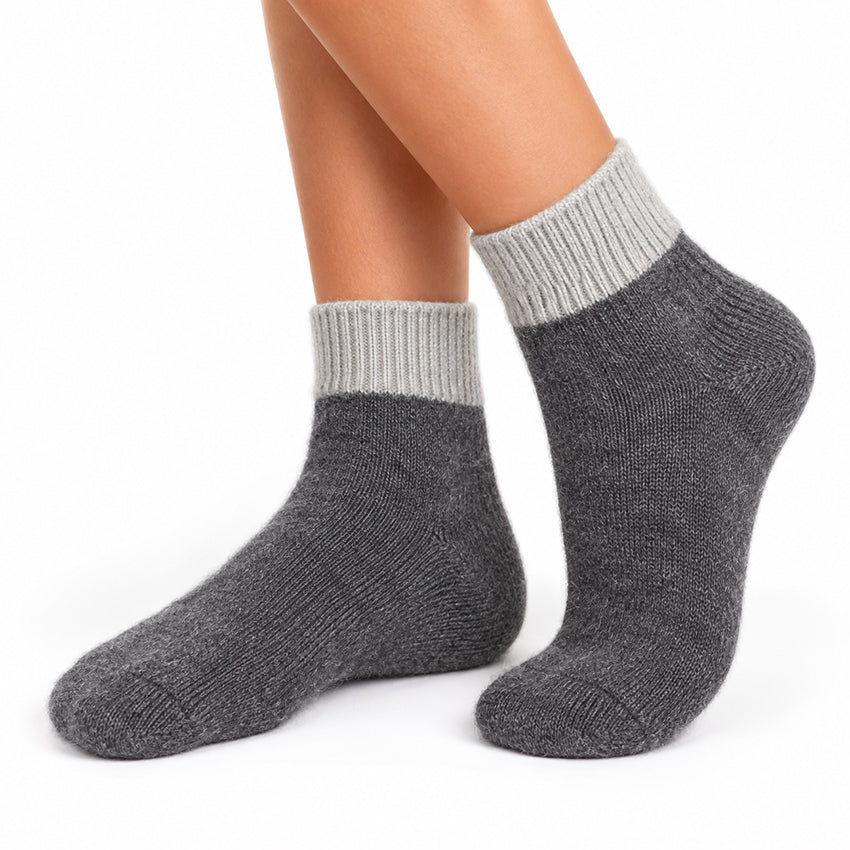 Women's grey pure cashmere ankle socks by Moda de la Maria shown worn on the feet, with naturally soft fluffy texture.