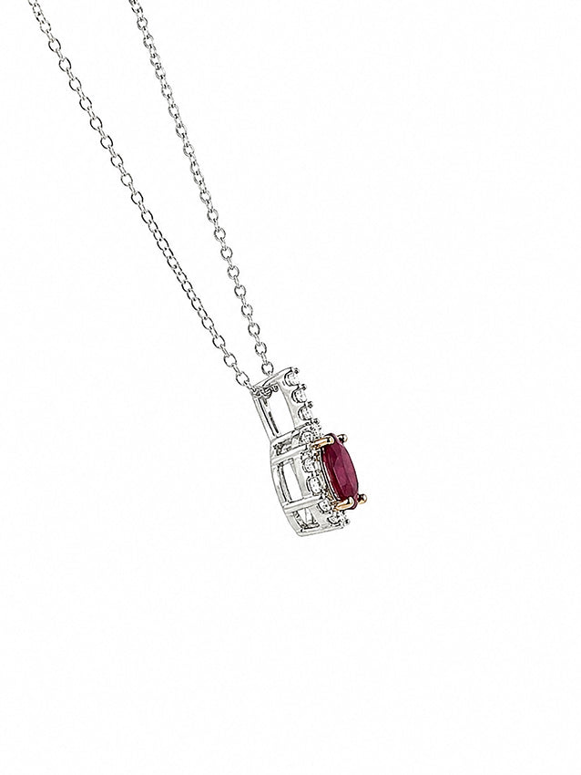 Minimalist ruby pendant necklace in sterling silver on clean white background, elegant jewellery design