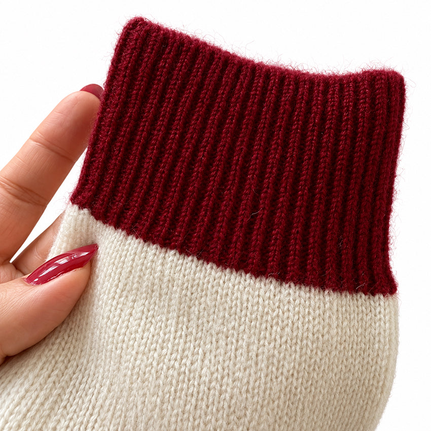 Close-up of ivory cream and deep red pure cashmere socks by Moda de la Maria showing the fine knit and naturally fluffy cashmere fibres.