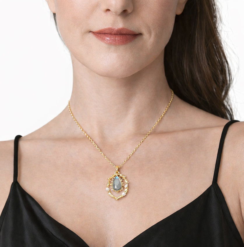 Gold labradorite pearl wreath necklace with detachable labradorite pendant on classic gold chain worn by a woman
