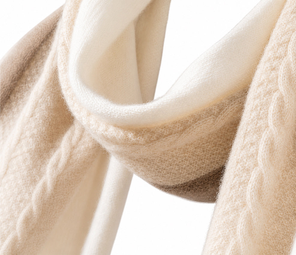 Close-up of the Moda de la Maria 100% pure cashmere cream and light brown scarf highlighting its exceptionally soft brushed texture and elegant folded finish.