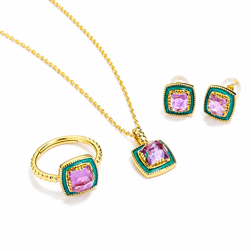 Amethyst enamel jewellery set by Moda de la Maria featuring gold plated sterling silver necklace, ring and earrings with purple gemstones on white background