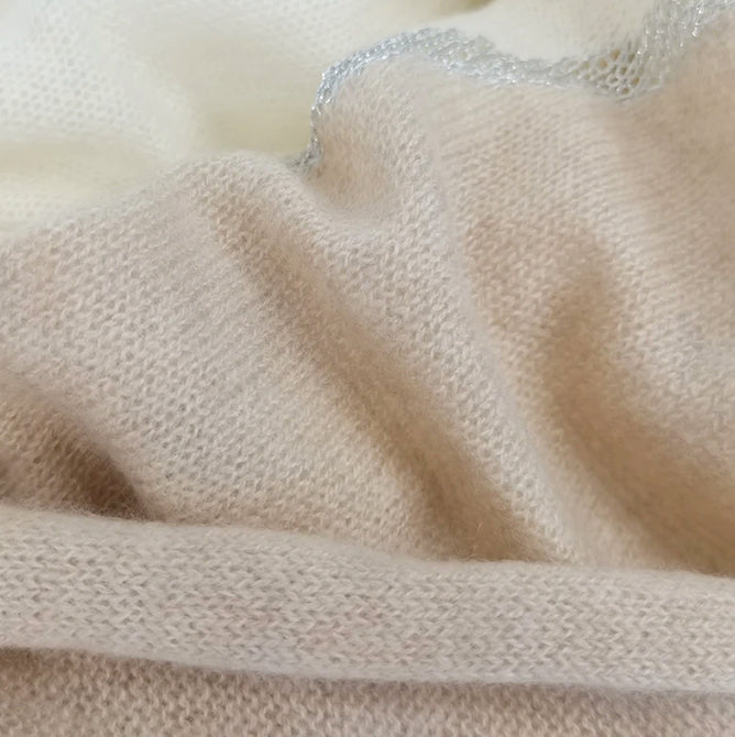 Close-up of Moda de la Maria 100% pure cashmere colour-block pashmina scarf in beige, taupe and cream, featuring an exceptionally soft knitted finish.