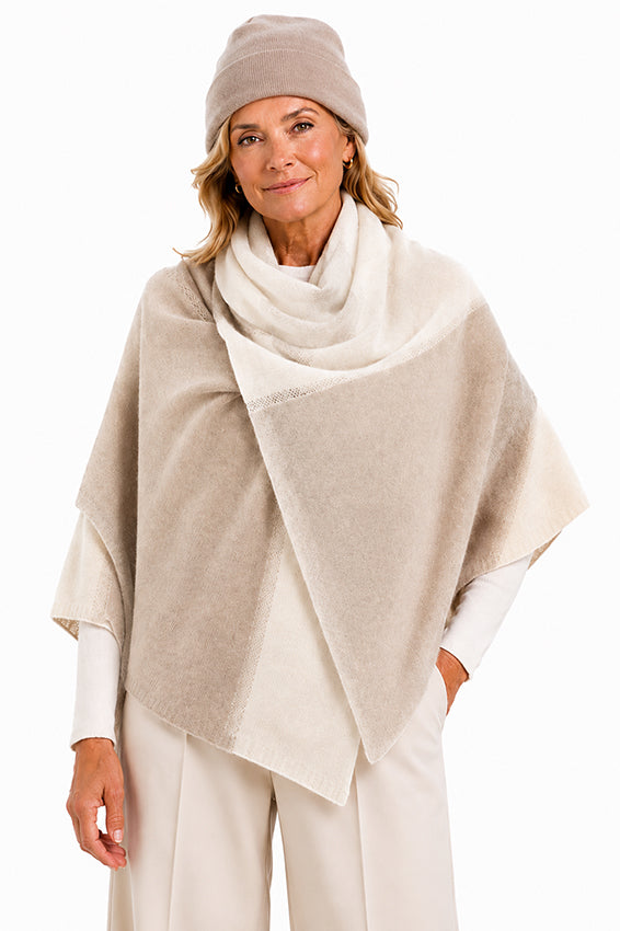 Elegant woman wearing a luxury pure cashmere wrap in cream and oatmeal with a matching oatmeal cashmere beanie by Moda de la Maria.