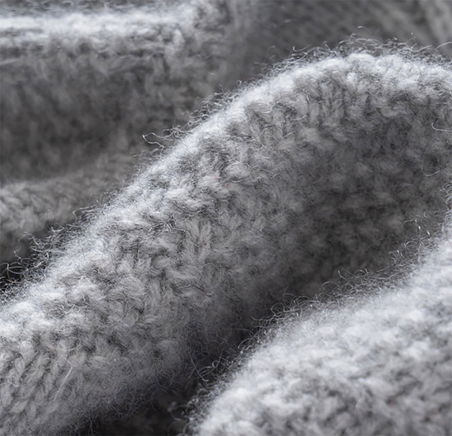Close-up of the soft cashmere knit texture and spiral detailing on the Moda de la Maria grey cashmere beret.