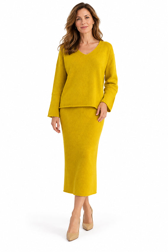 Woman wearing Moda de la Maria mustard yellow 100% pure cashmere two-piece sweater and midi skirt set