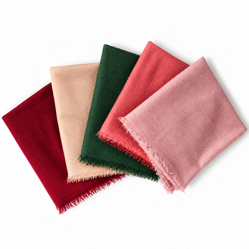 Folded Moda de la Maria lightweight 100% pure cashmere shawls in forest green, pink, coral, camel beige and black