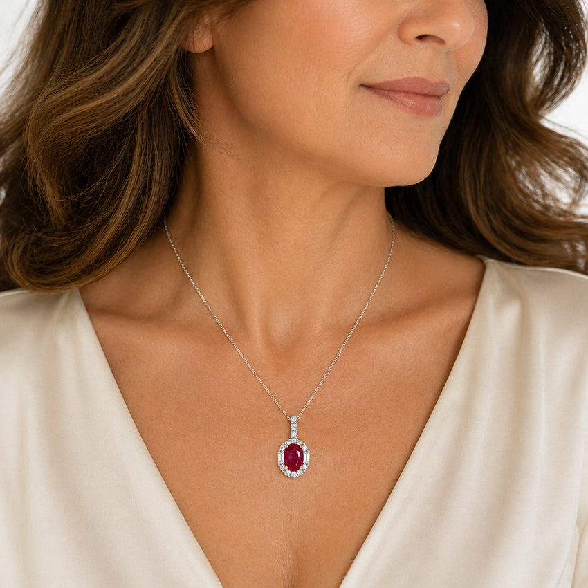 Elegant woman wearing Moda de la Maria ruby pendant necklace in sterling silver, luxury fine jewellery styling on model