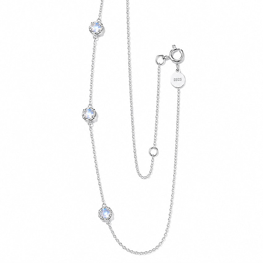 Close-up of natural moonstones in delicate floral sterling silver settings