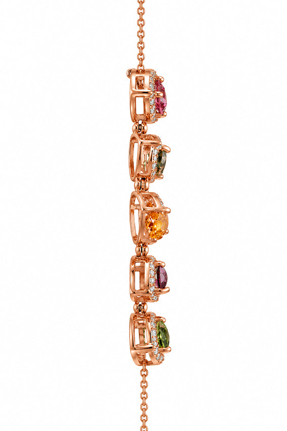 Side view of the multicolour heart necklace showing the rose gold settings, articulated joints and gemstone construction.