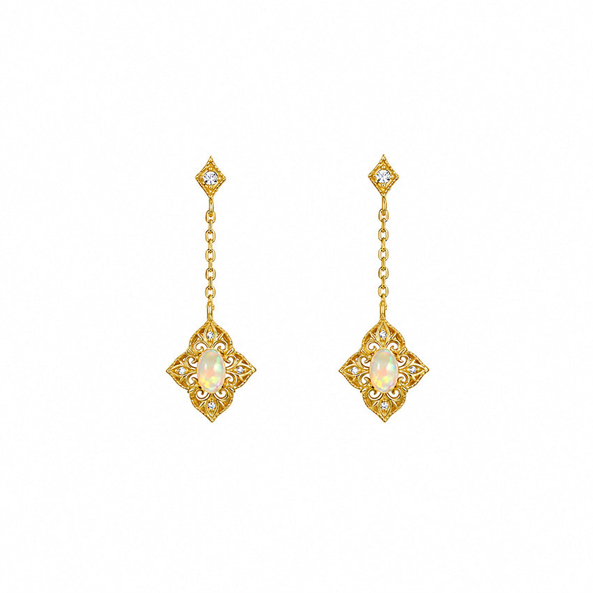 Gold-plated sterling silver opal drop earrings with Victorian-inspired filigree and zirconia detailing on a white background