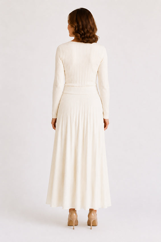 Back view of a luxury ivory organic cashmere knitted skirt, displaying the clean lines, soft knit structure and comfortable fit.
