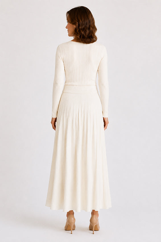 Back view of a luxury ivory organic cashmere knitted skirt, displaying the clean lines, soft knit structure and comfortable fit.