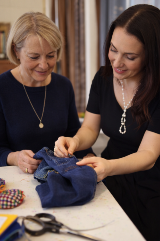 Private clothing repair and mending class in London with fashion designer Maria Ruseva teaching a student how to repair denim jeans.
