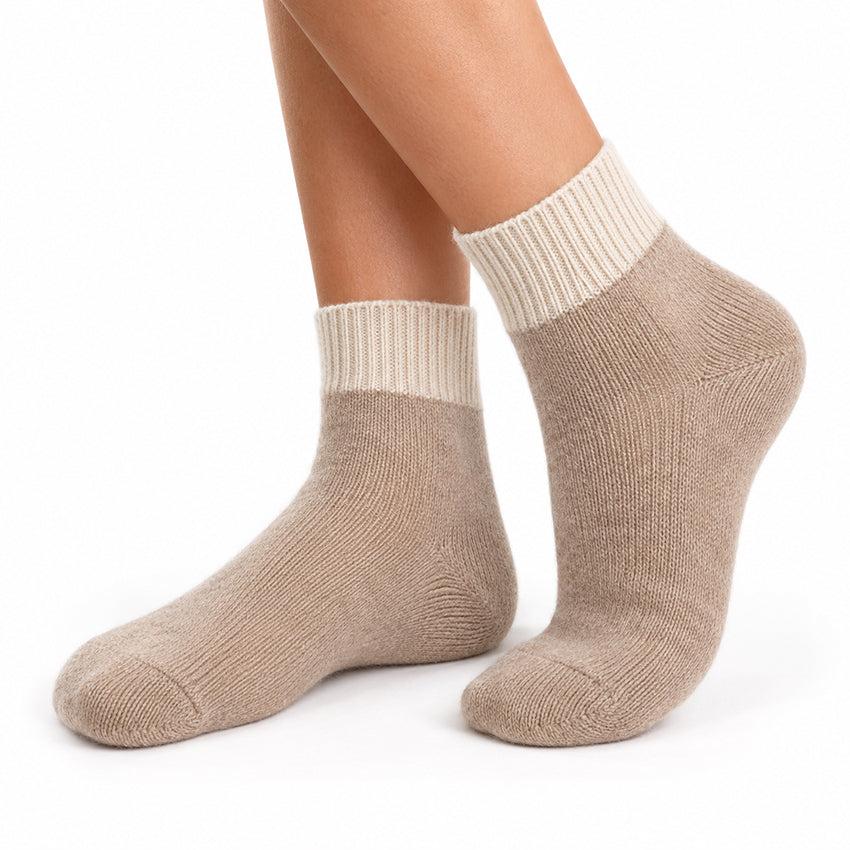 Women's taupe pure cashmere ankle socks by Moda de la Maria shown worn on the feet, highlighting the soft cashmere knit.