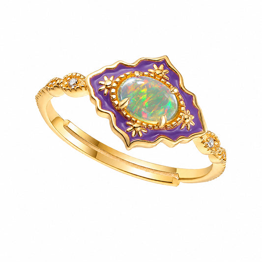 Adjustable Victorian-inspired opal ring shown at an angle with purple enamel detailing and decorative gold vermeil band.