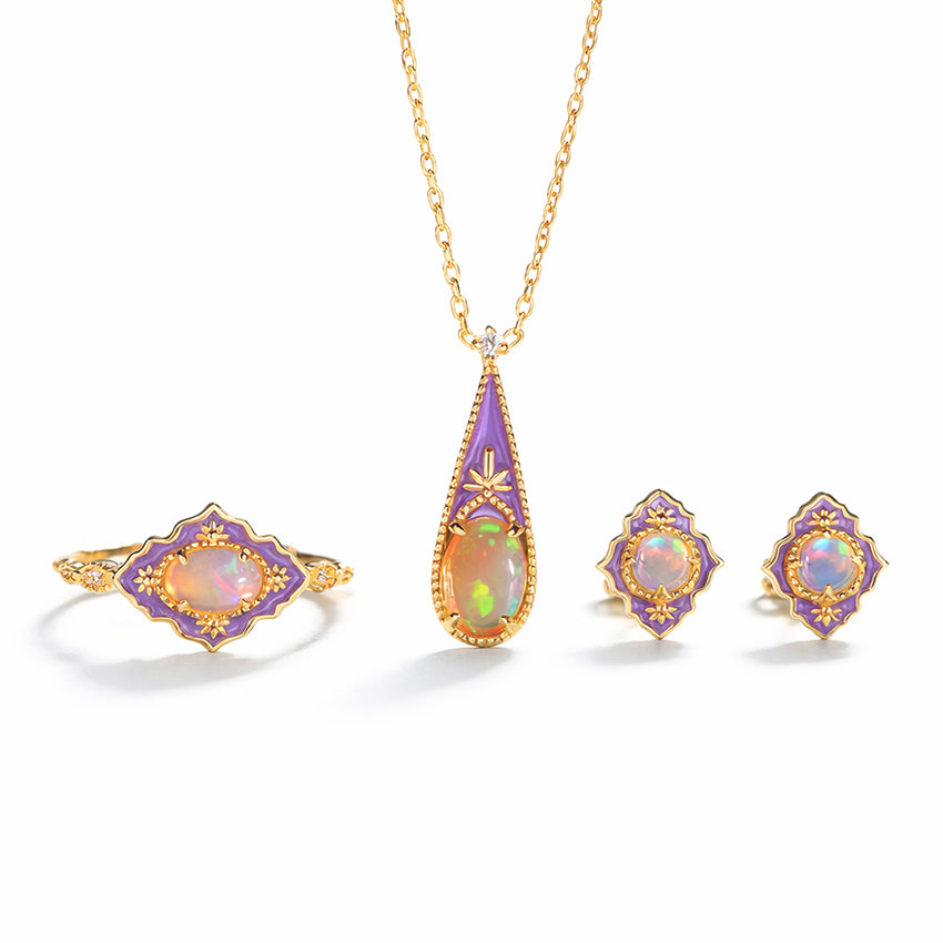 Victorian inspired opal enamel jewellery set in 925 sterling silver with gold vermeil plating including pendant necklace, stud earrings and ring on white background