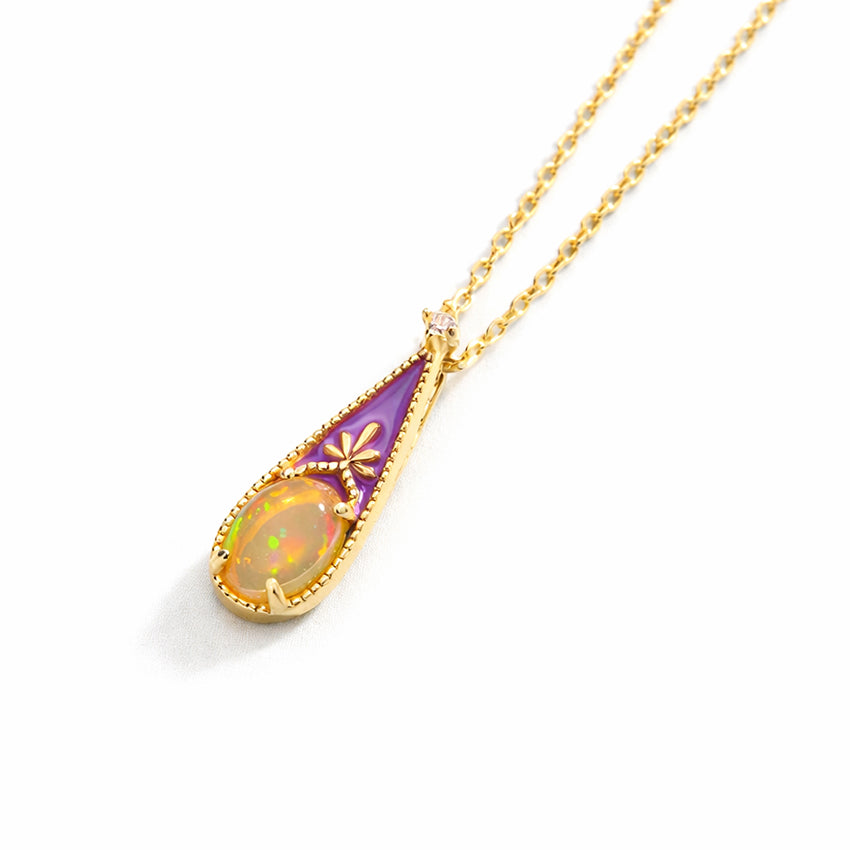 Victorian inspired opal pendant necklace in gold vermeil plated 925 sterling silver, delicate enamel teardrop design photographed at angle on clean white background
